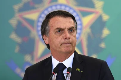 Brazilian President Jair Bolsonaro delivers a speech during the appointment ceremony of the new heads of public banks, at Planalto Palace in Brasilia on January 7, 2019. - Brazil's Finance Minister Paulo Guedes appointed the new presidents of the country's public banks. (Photo by EVARISTO SA / AFP)
