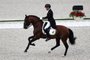 Joao Victor Marcari Oliva of Brazil rides Escoral in the dressage individual grand prix group A during the equestrian competition of the Tokyo 2020 Olympic Games at the Equestrian Park in Tokyo on July 24, 2021. (Photo by Behrouz MEHRI / AFP)Editoria: SPOLocal: TokyoIndexador: BEHROUZ MEHRISecao: equestrianFonte: AFPFotógrafo: STF<!-- NICAID(14843881) -->