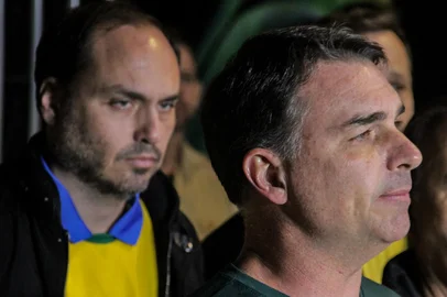 Brazilian Senator Flavio Bolsonaro (R), son of former President Jair Bolsonaro (2019-2022), speaks to the press during the launch of his pre-candidacy for the presidency, next to his brother Carlos Bolsonaro (L), in Florianopolis, Santa Catarina state, Brazil, on May 9, 2026. Brazilian senator Flavio Bolsonaro has emerged as President Luiz Inacio Lula da Silva's main rival in October's presidential election, in which the leftist is expected to seek a fourth term in office. (Photo by Vitor SOUZA / AFP)<!-- NICAID(16282101) -->