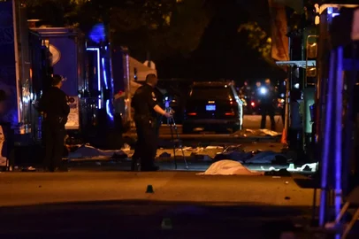 Vancouver police investigate a crime scene after a man drove into pedestrians at the annual Lapu Lapu festival celebrating Filipino culture, at East 43rd Avenue and Fraser, in the south of Vancouver on April 26, 2025. Canadian police arrested a man on April 26 after a car plowed into a street party in the western city of Vancouver killing a number of people. Authorities said the incident happened shortly after 8:00 pm (0300 GMT Sunday) in Vancouver's Sunset on Fraser neighborhood as members of the Filipino community gathered to celebrate Lapu Lapu Day. (Photo by Don MacKinnon / AFP)<!-- NICAID(16025204) -->