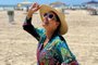 Cristina Ranzolin de chapéu na praia de Torres<!-- NICAID(15646775) -->
