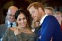 (FILES) In this file photo taken on January 18, 2018 Britain's Prince Harry and his fiancée US actress Meghan Markle watch a dance performance by Jukebox Collective during a visit at Cardiff Castle in Cardiff, south Wales on January 18, 2018, for a day showcasing the rich culture and heritage of WalesMeghan Markle once struggled for roles but the US actress has now landed the biggest part of all as she prepares to marry Prince Harry on May 19, 2018 and become the newest face in Britain's royal family. / AFP PHOTO / POOL / Ben Birchall