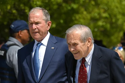 (FILES) In this file photo taken on September 11, 2019 former US President George W. Bush and Defense Secretary Donald Rumsfeld attend a ceremony to mark the 18th anniversary of the 9/11 attacks,at the Pentagon in Washington, DC. - Former US defense secretary Donald Rumsfeld, who led the nation into war in Afghanistan and Iraq during the presidency of George W Bush, has died at the age of 88 in New Mexico, his family announced June 30, 2021. (Photo by MANDEL NGAN / AFP)<!-- NICAID(14822368) -->