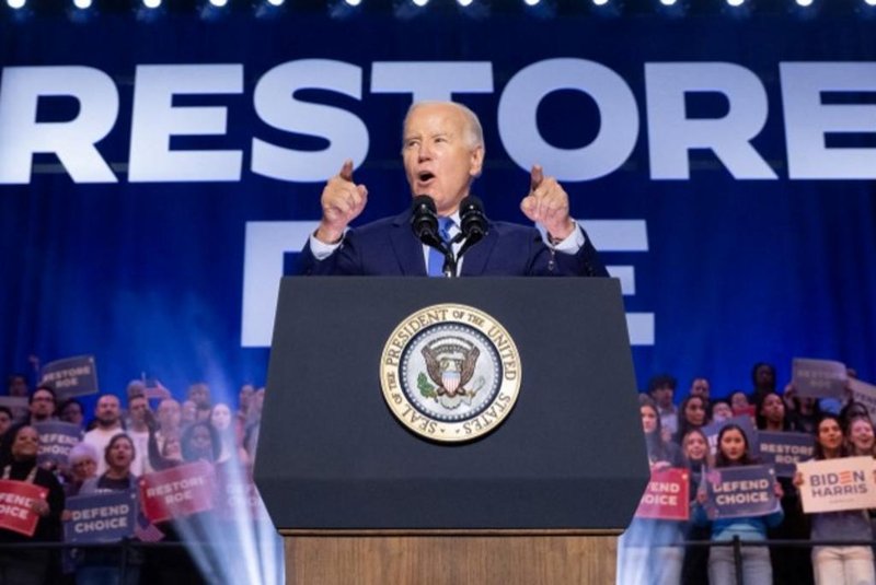 US President Joe Biden speaks during a campaign rally to Restore Roe at Hylton Performing Arts Center in Manassas, Virginia, on January 23, 2024. Protesters chanting slogans against Israel's offensive in Gaza repeatedly interrupted US President Joe Biden on Tuesday during an election campaign event to promote abortion rights. (Photo by SAUL LOEB / AFP)<!-- NICAID(15658552) -->
