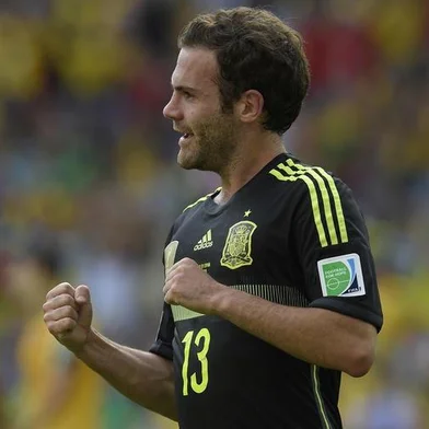 491933361Spain's forward Juan Mata celebrates after scoring his team's third goal during a Group B match between Australia and Spain at the Baixada Arena in Curitiba during the 2014 FIFA World Cup on June 23, 2014.   AFP PHOTO / LLUIS GENEEditoria: SPOLocal: CuritibaIndexador: LLUIS GENESecao: SoccerFonte: AFPFotógrafo: STF