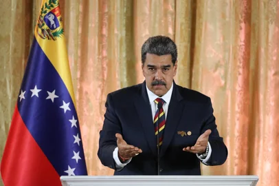 This handout picture released by the Venezuelan Presidency shows Venezuelan President Nicolas Maduro speaking during an act to present the Organic Law for the Defense of "Guyana Esequiba" at the National Assembly in Caracas on April 3, 2024. Venezuelan President Nicolás Maduro denounced on Wednesday the installation of "secret military bases" of the United States in the Essequibo, an oil-rich area that his country disputes with Guyana. (Photo by ZURIMAR CAMPOS / Venezuelan Presidency / AFP) / RESTRICTED TO EDITORIAL USE - MANDATORY CREDIT "AFP PHOTO / VENEZUELAN PRESIDENCY / Zurimar CAMPOS " - NO MARKETING - NO ADVERTISING CAMPAIGNS - DISTRIBUTED AS A SERVICE TO CLIENTS<!-- NICAID(15725331) -->