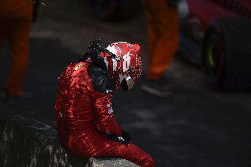 Ferrari's Monegasque driver Charles Leclerc sits on a barrier after crashing at the start of the Formula One Brazil Grand Prix at the Autodromo Jose Carlos Pace racetrack, also known as Interlagos, in Sao Paulo, Brazil, on November 5, 2023. (Photo by DOUGLAS MAGNO / AFP)Editoria: SPOLocal: Sao PauloIndexador: DOUGLAS MAGNOSecao: motor racingFonte: AFPFotógrafo: STR<!-- NICAID(15589120) -->