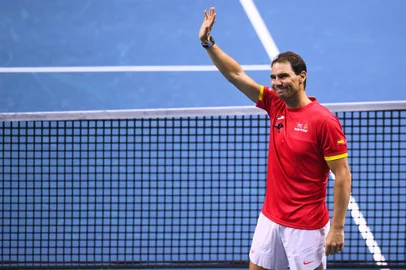 Spain's Rafael Nadal waves during a tribute to his career at the end of the quarter-final doubles match between Netherlands and Spain during the Davis Cup Finals at the Palacio de Deportes Jose Maria Martin Carpena arena in Malaga, southern Spain, on November 19, 2024. Superstar Rafael Nadal's glittering career in professional tennis came to an end on November 19, 2024 as Netherlands eliminated Spain in the Davis Cup quarter-finals. (Photo by JORGE GUERRERO / AFP)<!-- NICAID(15917282) -->