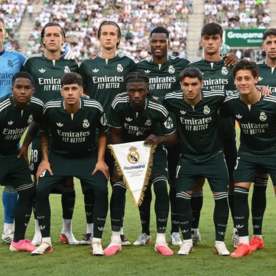 Real Madrid players pose for the team photo prior to the pre-season football match between Ferencvaros and Real Madrid in Budapest, Hungary on August 8, 2026. Real Madrid on August 6, 2026 announced a new six-year deal for star forward Vinicius Junior and the signing of teenage sensation Yan Diomande in a major boost to their quest to end a two-year trophy drought. (Photo by ATTILA KISBENEDEK / AFP)<!-- NICAID(16343369) -->