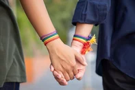 hand of LGBT women holding together with rainbow ribbon symbol; concept of LGBT pride, LGBTQ people, lgbt rights campaign, same sex marriagehand of LGBT women holding together with rainbow ribbon symbol; concept of LGBT pride, LGBTQ people, lgbt rights campaign, same sex marriageIndexador: TheepatheepKawinpathaweeFonte: 316935357<!-- NICAID(16301761) -->