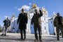 US President Joe Biden (C-L) walks with Ukrainian President Volodymyr Zelensky (C-R) at St. Michael's Golden-Domed Cathedral during an unannounced visit, in Kyiv on February 20, 2023. - US President Joe Biden promised increased arms deliveries for Ukraine during a surprise visit to Kyiv on February 20, 2023, in which he also vowed Washington's "unflagging commitment" in defending Ukraine's territorial integrity. (Photo by Evan Vucci / POOL / AFP)<!-- NICAID(15356605) -->
