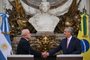 Brazilian President Luiz Inacio Lula da Silva (L) and Argentine President Alberto Fernandez (R) shake hands during a press conference at the Casa Rosada presidential palace in Buenos Aires on January 23, 2023. - Brazil's President Luiz Inacio Lula da Silva began his first international tour last Sunday with a visit to Argentina and Uruguay with the aim of restoring regional leadership to Brazil after the management of the far-right Jair Bolsonaro. (Photo by Luis ROBAYO / AFP)<!-- NICAID(15328973) -->