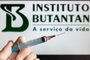 SÃ£o Paulo, Brazil - March 26, 2021: detail of the vaccine vaccine and in the blurred background the name Instituto Butantan, which developed the Butanvac vaccine.Fonte: 423211960<!-- NICAID(15673521) -->