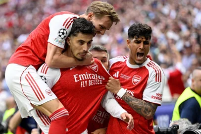 Arsenal's German forward #29 Kai Havertz (2L) celebrates after scoring the opening goal with Arsenal's Norwegian midfielder #08 Martin Odegaard (L) and teammates during the UEFA Champions League final football match between Paris Saint-Germain (PSG) and Arsenal FC at the Puskas Arena in Budapest on May 30, 2026. (Photo by INA FASSBENDER / AFP)<!-- NICAID(16296763) -->