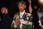 US Louis Vuitton' fashion designer and singer Pharrell Williams acknowledges the audience at the end of the Louis Vuitton Menswear Spring-Summer 2024 show as part of the Paris Fashion Week on the Pont Neuf, central Paris, on June 20, 2023. (Photo by STEFANO RELLANDINI / AFP)<!-- NICAID(15462089) -->