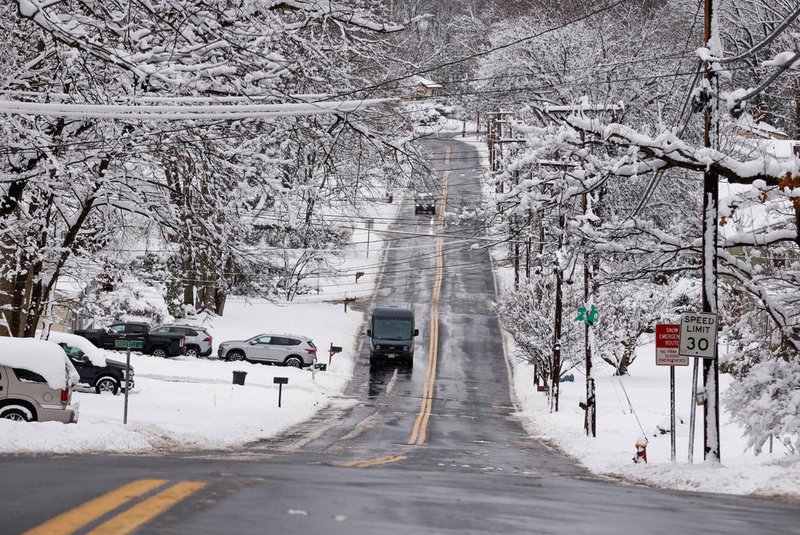 An Amazon truck drives by a area covered by snow in Tappan, New York, on February 13, 2024. Millions of people in the northeastern US were engulfed by snow on February 13 as a powerful winter storm battered the region causing flight cancellations and closing schools. (Photo by KENA BETANCUR / AFP)<!-- NICAID(15678624) -->