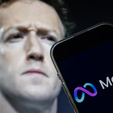 This photo illustration created on January 7, 2025, in Washington, DC, shows an image of Mark Zuckerberg, CEO of Meta, and an image of the Meta logo. Social media giant Meta on January 7, 2025, slashed its content moderation policies, including ending its US fact-checking program, in a major shift that conforms with the priorities of incoming president Donald Trump. (Photo by Drew ANGERER / AFP)<!-- NICAID(15949107) -->