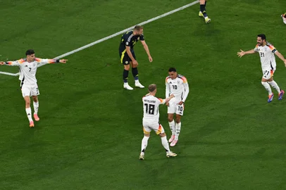 Football: UEFA Euro 2024 - 1st round day 1: Group A Germany v ScotlandGermany's midfielder #10 Jamal Musiala (C) celebrates after scoring his teams' second goal during the UEFA Euro 2024 Group A football match between Germany and Scotland at the Munich Football Arena in Munich on June 14, 2024. (Photo by THOMAS KIENZLE / AFP)Editoria: SPOLocal: MunichIndexador: THOMAS KIENZLESecao: soccerFonte: AFPFotógrafo: STR<!-- NICAID(15789706) -->