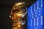 (FILES) In this file photo taken on December 09, 2019 Golden Globe trophies are set by the stage ahead of the 77th Annual Golden Globe Awards nominations announcement at the Beverly Hilton hotel in Beverly Hills. - Hollywood's awards season kicks into high gear on February 28, 2021, with the Golden Globes, but the usual boozy party will be replaced with a pandemic-proof ceremony, hosted by comedians Tina Fey and Amy Poehler from New York and Beverly Hills. The ceremony will certainly be unusual, given that the stars cannot gather en masse for what is usually the party of the year, but that does not mean the potential for zany fun is completely lost. After all, if the A-listers cannot convene at the Beverly Hilton, they can always drink champagne at home before they appear at camera to accept their awards. (Photo by Robyn BECK / AFP)Editoria: ACELocal: Beverly HillsIndexador: ROBYN BECKSecao: culture (general)Fonte: AFPFotógrafo: STF<!-- NICAID(14722595) -->