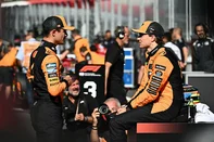 Pole position winner McLaren's British driver Lando Norris (L) speaks with team mate third placed McLaren's Australian driver Oscar Piastri after the qualifying session at the Red Bull Ring race track in Spielberg, Austria, on June 28, 2025, ahead of the Formula One Austrian Grand Prix. (Photo by Joe Klamar / AFP)<!-- NICAID(16075274) -->