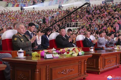 This picture taken on July 27, 2023 and released by North Korea's official Korean Central News Agency (KCNA) on July 27 shows North Korean leader Kim Jong Un (C), with Chinese Communist Party politburo member Li Hongzhong (4th R) and Russian Defence Minister Sergei Shoigu (L), attending the grand celebration performance celebrating the 70th anniversary of the victory of the Fatherland Liberation War at the Ryugyong Chung Ju-yung Gymnasium in Pyongyang. (Photo by KCNA VIA KNS / AFP) / - South Korea OUT / ---EDITORS NOTE--- RESTRICTED TO EDITORIAL USE - MANDATORY CREDIT "AFP PHOTO/KCNA VIA KNS" - NO MARKETING NO ADVERTISING CAMPAIGNS - DISTRIBUTED AS A SERVICE TO CLIENTSTHIS PICTURE WAS MADE AVAILABLE BY A THIRD PARTY. AFP CAN NOT INDEPENDENTLY VERIFY THE AUTHENTICITY, LOCATION, DATE AND CONTENT OF THIS IMAGE. / <!-- NICAID(15493347) -->