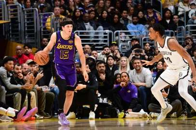 LOS ANGELES, CA - JANUARY 17: Austin Reaves #15 of the Los Angeles Lakers dribbles the ball during the game against the Brooklyn Nets on January 17, 2025 at Crypto.Com Arena in Los Angeles, California. NOTE TO USER: User expressly acknowledges and agrees that, by downloading and/or using this Photograph, user is consenting to the terms and conditions of the Getty Images License Agreement. Mandatory Copyright Notice: Copyright 2025 NBAE   Adam Pantozzi/NBAE via Getty Images/AFP (Photo by Adam Pantozzi / NBAE / Getty Images / Getty Images via AFP)<!-- NICAID(15956378) -->