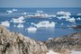 (FILES) In this file photo taken on August 15, 2019 an aerial photo taken on August 15, 2019 shows icebergs as they float along the eastern cost of Greenland near Kulusuk (aslo spelled Qulusuk). - Rising global temperature, rising sea levels, intensification of extreme events... The publication of the report of the Intergovernmental Panel on Climate Change (IPCC) is scheduled on August 9. (Photo by Jonathan NACKSTRAND / AFP)<!-- NICAID(14857780) -->