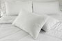 White pillows on a bed Comfortable soft pillows on the bedFonte: 87358704<!-- NICAID(15547259) -->