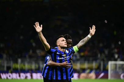Inter Milan's Argentine forward #10 Lautaro Martinez celebrates scoring his team's first goal during the UEFA Champions League semi-final second leg football match between Inter Milan and FC Barcelona at the San Siro stadium in Milan on May 6, 2025. (Photo by Marco BERTORELLO / AFP)<!-- NICAID(16042535) -->