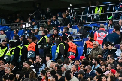 Medics and stewards are seen in the stands after a medical incident occurred during the UEFA Nations League final football match between Portugal and Spain in Munich, southern  on June 8, 2025. (Photo by Tobias SCHWARZ / AFP)<!-- NICAID(16055389) -->