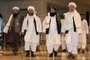 Head of the Taliban delegation Abdul Salam Hanafi (R), accompanied by Taliban officials (2R to L) Amir Khan Muttaqi, Shahabuddin Delawar and Abdul Latif Mansour, walks down a hotel lobby during the talks in Qatar's capital Doha on August 12, 2021. - Afghan government negotiators in Qatar have offered the Taliban a power-sharing deal in return for an end to fighting in the country, a government negotiating source told AFP. (Photo by KARIM JAAFAR / AFP)<!-- NICAID(14860648) -->