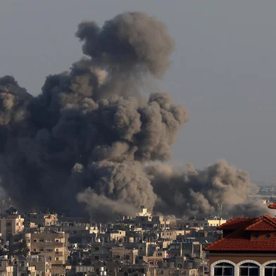 A picture taken from Rafah shows smoke billowing over Khan Yunis in the southern Gaza Strip during Israeli bombardment on January 24, 2024, amid ongoing battles between Israel and the Palestinian militant group Hamas. (Photo by AFP)<!-- NICAID(15659817) -->