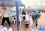 Moradores fazem fila desde cedo para receber doações na Vila Farrapos, em Porto Alegre 