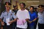 Brazilian retired football player Ronaldinho (C) and his brother Roberto Assis (R) arrive at Asuncion's Justice Palace to appear before a public prosecutor who will decide whether to grant them bail or not following their irregular entry to the country, in Asuncion, on March 7, 2020. - Former Brazilian football star Ronaldinho and his brother have been detained in Paraguay after allegedly using fake passports to enter the South American country, authorities said Wednesday. (Photo by Norberto DUARTE / AFP)Editoria: CLJLocal: AsuncionIndexador: NORBERTO DUARTESecao: soccerFonte: AFPFotógrafo: STR<!-- NICAID(14443850) -->