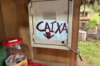 MARQUES DE SOUZA, RS, BRASIL - 20/01/2026 - Uma tenda de beira de estrada tem chamado a atenção dos motoristas que passam pela BR-386, em Marques de Souza, no Vale do Taquari. Na "Pé da Serra", o cliente escolhe os produtos, faz o Pix ou deixa o dinheiro em um cofre chaveado e pode seguir viagem (Foto: Júlia Amaral/Agencia RBS)<!-- NICAID(16207855) -->