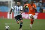 491717409Argentina's forward Ezequiel Lavezzi (L) and Netherlands' midfielder Georginio Wijnaldum vie for the ball during the semi-final football match between Netherlands and Argentina of the FIFA World Cup at The Corinthians Arena in Sao Paulo on July 9, 2014.  AFP PHOTO / ADRIAN DENNISEditoria: SPOLocal: Sao PauloIndexador: ADRIAN DENNISSecao: SoccerFonte: AFPFotógrafo: STF<!-- NICAID(10657846) -->