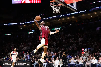 MIAMI, FLORIDA - MARCH 10: Bam Adebayo #13 of the Miami Heat dunks the ball against the Washington Wizards during the third quarter of the game at Kaseya Center on March 10, 2026 in Miami, Florida. NOTE TO USER: User expressly acknowledges and agrees that, by downloading and or using this photograph, User is consenting to the terms and conditions of the Getty Images License Agreement.   Megan Briggs/Getty Images/AFP (Photo by Megan Briggs / GETTY IMAGES NORTH AMERICA / Getty Images via AFP)<!-- NICAID(16242775) -->