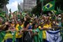 Supporters of former Brazilian President Jair Bolsonaro (2019-2022) attend a rally in Sao Paulo, Brazil, on February 25, 2024, to reject claims he plotted a coup with allies to remain in power after his failed 2022 reelection bid. Investigators say the far-right ex-army captain led a plot to falsely discredit the Brazilian election system and prevent the winner of the vote, leftist President Luiz Inacio Lula da Silva, from taking power. A week after Lula took office on January 1, 2023, thousands of Bolsonaro supporters stormed the presidential palace, Congress and Supreme Court, urging the military to intervene to overturn what they called a stolen election. (Photo by NELSON ALMEIDA / AFP)<!-- NICAID(15689170) -->