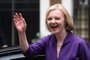New Conservative Party leader and incoming prime minister Liz Truss smiles and waves as she arrives at Conservative Party Headquarters in central London having been announced the winner of the Conservative Party leadership contest at an event in central London on September 5, 2022. - Truss is the UK's third female prime minister following Theresa May and Margaret Thatcher. The 47-year-old has consistently enjoyed overwhelming support over 42-year-old Sunak in polling of the estimated 200,000 Tory members who were eligible to vote. (Photo by Daniel LEAL / AFP)<!-- NICAID(15197816) -->