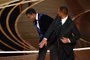 US actor Will Smith (R) slaps US actor Chris Rock onstage during the 94th Oscars at the Dolby Theatre in Hollywood, California on March 27, 2022. (Photo by Robyn Beck / AFP)<!-- NICAID(15052743) -->