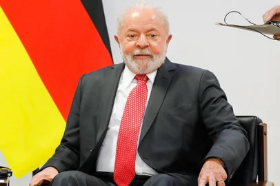Brazilian President Luiz Inacio Lula da Silva gestures during a meeting with German Chancellor Olaf Scholz (out of frame) at the Planalto Palace in Brasilia, January 30, 2023. - Germany promised an additional 31 million euros ($33 million) for the Brazilian Amazon Monday as Chancellor Olaf Scholz visited the South American giant reeling from rainforest destruction under ex-president Jair Bolsonaro. (Photo by Sergio Lima / AFP)<!-- NICAID(15335527) -->