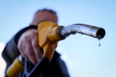 A drop of petrol falls from the nozzle of a petrol pump at a petrol station in Vélizy-Villacoublay, near Paris, on March 9, 2026, as Oil prices soared peaking just short of $120 a barrel as the US-Israeli war against Iran continued into a second week, with Tehran launching fresh retaliatory strikes in the Gulf. (Photo by Alain JOCARD / AFP)<!-- NICAID(16241360) -->