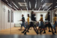 Group of office employees at coworking center. Business people walking at modern open space. Motion blur. ConceptGroup of office employees at coworking center. Business people walking at modern open space. Motion blur. ConceptFonte: 300203685<!-- NICAID(15854565) -->