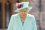 (FILES) In this file photo taken on July 17, 2020 Britain's Queen Elizabeth II poses after confering the honour of a knighthood upon 100-year-old veteran Captain Tom Moore during an investiture at Windsor Castle in Windsor, west of London. - Elizabeth II celebrates her 95th birthday on Wednesday, April 21, four days after having buried her husband of 73 years, Prince Philip, whom she described as her great "support". (Photo by Chris Jackson / POOL / AFP)<!-- NICAID(14763205) -->