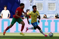 Brazil's forward #07 Vinicius Junior (R) runs with the ball past Morocco's defender #02 Achraf Hakimi (L) during the 2026 World Cup Group C football match between Brazil and Morocco at the New York/New Jersey Stadium in East Rutherford on June 13, 2026. (Photo by CHARLY TRIBALLEAU / AFP)<!-- NICAID(16305833) -->