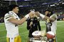MINNEAPOLIS, MINNESOTA - DECEMBER 31: Jordan Love #10 and Aaron Jones #33 of the Green Bay Packers celebrate after a 33-10 victory against the Minnesota Vikings at U.S. Bank Stadium on December 31, 2023 in Minneapolis, Minnesota. Stephen Maturen/Getty Images/AFP