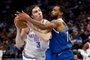 MINNEAPOLIS, MINNESOTA - NOVEMBER 28: Josh Giddey #3 of the Oklahoma City Thunder goes to the basket while Mike Conley #10 of the Minnesota Timberwolves defends in the third quarter during an NBA In-Season Tournament game at Target Center on November 28, 2023 in Minneapolis, Minnesota. The Timberwolves defeated the Thunder 106-103. NOTE TO USER: User expressly acknowledges and agrees that, by downloading and or using this photograph, User is consenting to the terms and conditions of the Getty Images License Agreement.   David Berding/Getty Images/AFP (Photo by David Berding / GETTY IMAGES NORTH AMERICA / Getty Images via AFP)<!-- NICAID(15611802) -->