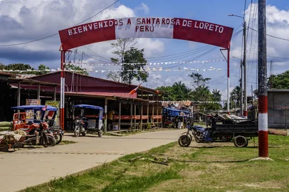 A welcome sign is pictured in Santa Rosa Island, Peru on August 5, 2025. Peru on August 5, 2025, expressed its "strong protest" over statements by Colombia's President Gustavo Petro questioning its sovereignty over an Amazonian island on the shared border between the two countries, according to a statement from the Foreign Ministry. (Photo by Santiago RUIZ / AFP)<!-- NICAID(16097214) -->
