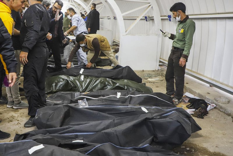 The bodies of victims killed in two explosions in quick succession that struck a crowd marking the anniversary of the 2020 killing of Guards general Qasem Soleimani, lie at a hospital in the southern Iranian city of Kerman on January 3, 2024. Iran's president Ebrahim Raisi condemned on January 3 twin blasts that killed at least 103 people in the country's south where crowds gathered to mark the killing of general Qasem Soleimani. (Photo by SARE TAJALLI / ISNA / AFP)<!-- NICAID(15641233) -->