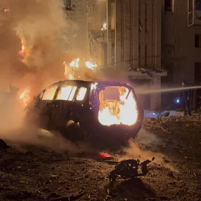This handout picture taken and released by the Ukrainian State Emergency Service on December 8, 2025 shows firefighters working to extinguish a fire following a drone attack to a residential building in Okhtyrka, Sumy region, amid the Russian invasion of Ukraine. (Photo by Handout / Ukrainian State Emergency Service / AFP) / XGTY / RESTRICTED TO EDITORIAL USE - MANDATORY CREDIT "AFP PHOTO / UKRAINIAN STATE EMERGENCY SERVICE " - NO MARKETING NO ADVERTISING CAMPAIGNS - DISTRIBUTED AS A SERVICE TO CLIENTS<!-- NICAID(16183304) -->